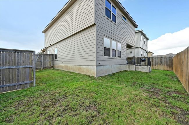 View of property exterior featuring a fenced backyard | Image 17