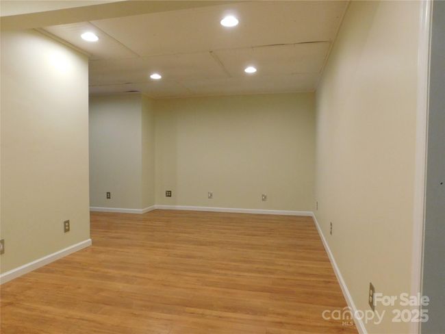 Possible movie room, craft/hobby room. | Image 38