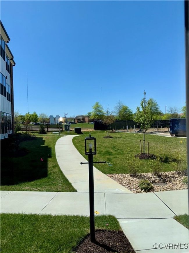 Surrounding community with a lawn and fence | Image 15