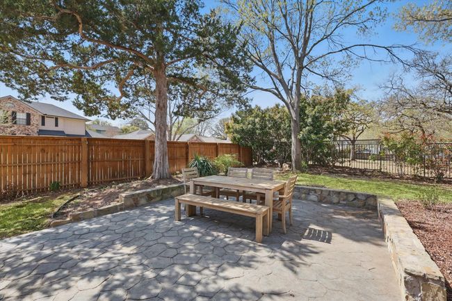 Fenced backyard featuring outdoor dining area and a patio area | Image 27