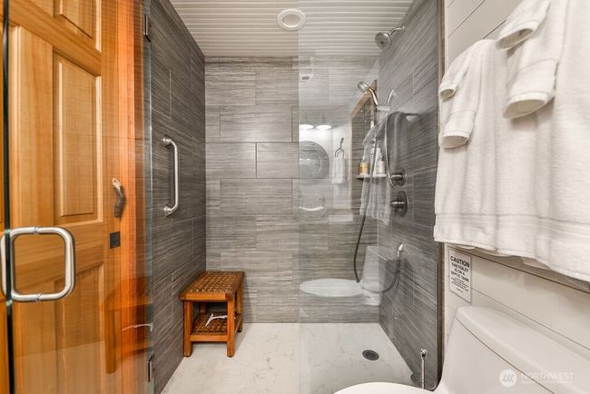 Beautiful custom finishes in bathroom on main floor with shower. | Image 11