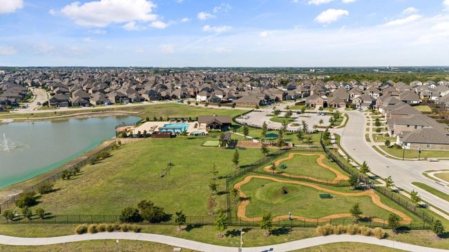 Aerial view of property community with a nearby body of water and nearby suburban area | Image 20