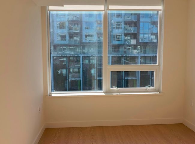 Spare room featuring wood finished floors and baseboards | Image 14