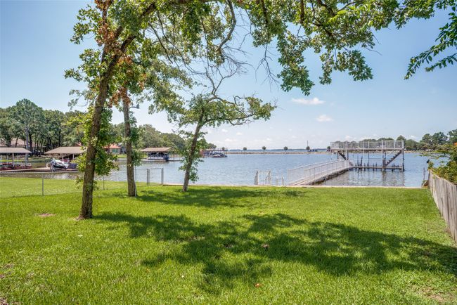 View of yard featuring water view | Image 24