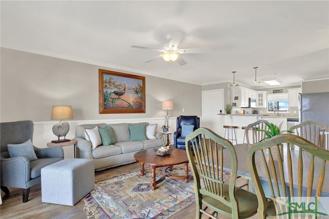 Living Room open to Kitchen & Dining Area with Sliding Glass Door to Spacious Balcony | Image 5