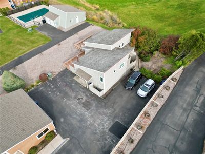 Birds eye view of property, clubhouse and outdoor pool are also pictured. | Image 3