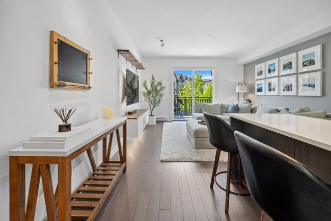 Living room featuring dark wood-style floors | Image 5