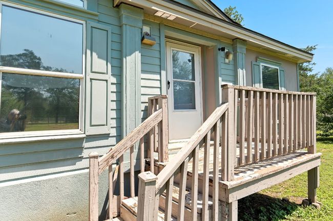 Property entrance featuring a wooden deck | Image 5