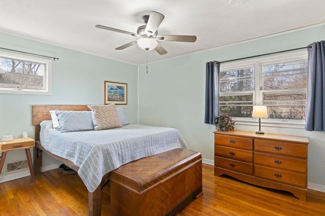 Primary Bedroom featuring hardwood floors and ceiling fan | Image 15