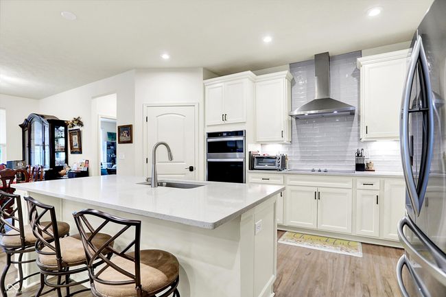 Kitchen open to Family room and Dining area WOW Upscale LG refrigerator included | Image 5