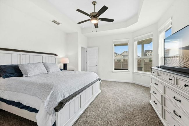 Cozy up in this primary bedroom | Image 17
