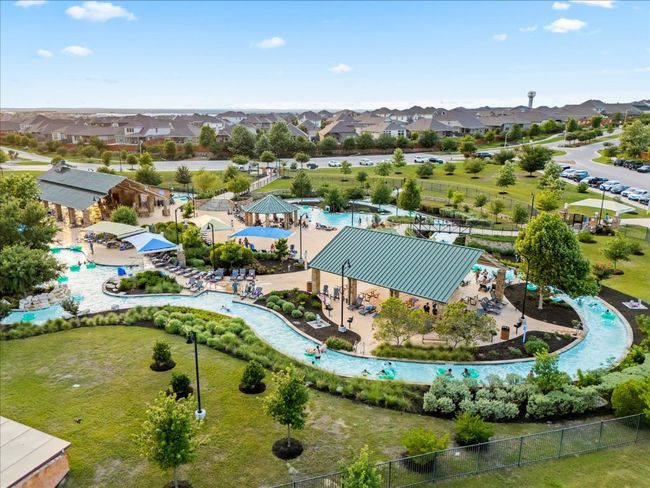 Aerial perspective of lazy river. This community has two lazy river areas, seperate third pool area, parks, and amenities center. | Image 36