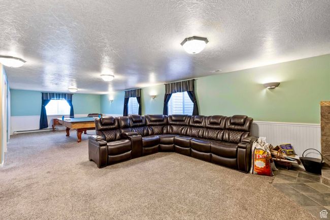 The downstairs Family Room is huge and can be used as both a Theater and a Recreational Room | Image 16