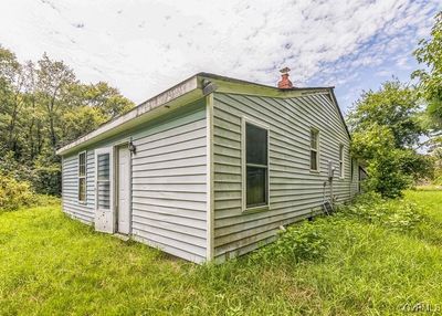 View of home's exterior featuring a yard | Image 2