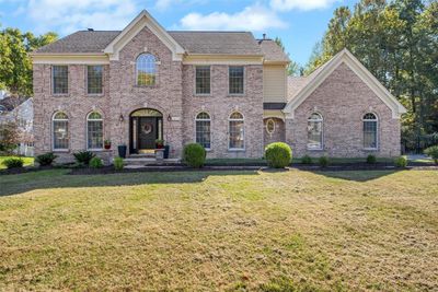 Colonial home with a front lawn | Image 1