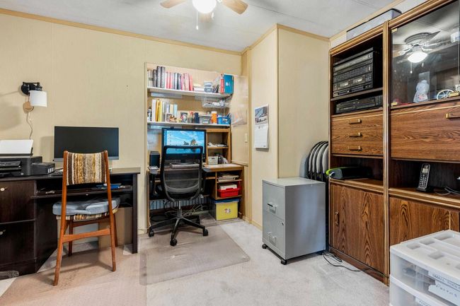 Office with a ceiling fan, carpet floors, and ornamental molding | Image 18