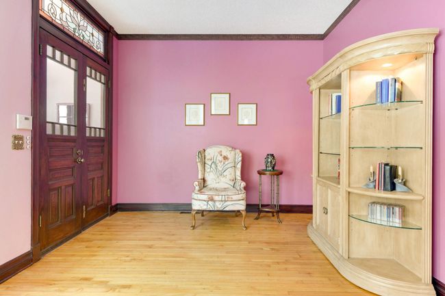 A view of the east end of the living room. The original maple floors are in excellent condition. | Image 6