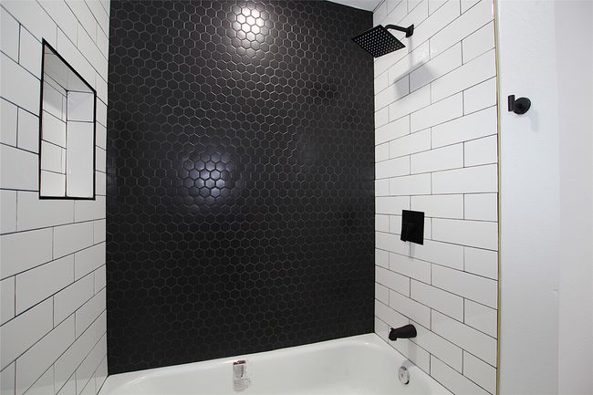Full bathroom featuring shower / bathtub combination | Image 12