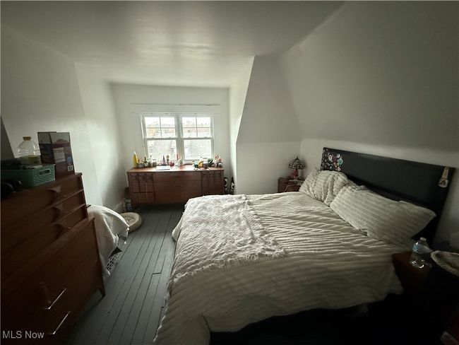 Bedroom with hardwood / wood-style flooring | Image 10