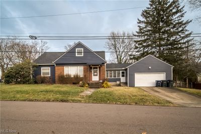 View of front of house with a garage and a front yard | Image 1