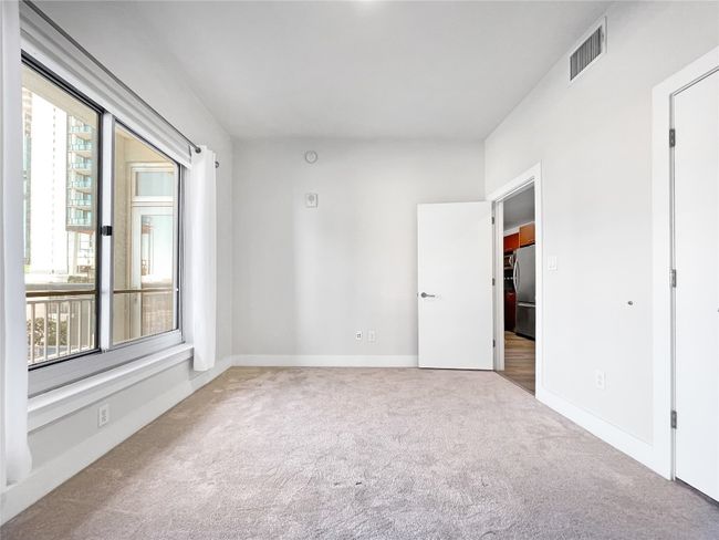 Carpeted spare room with baseboards | Image 16