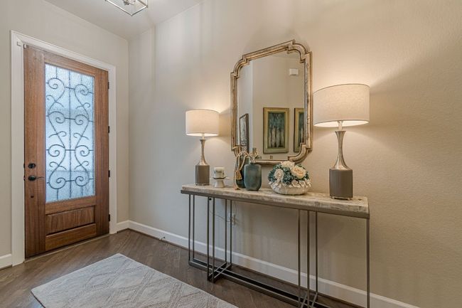 Entryway with dark wood-type flooring and baseboards | Image 5