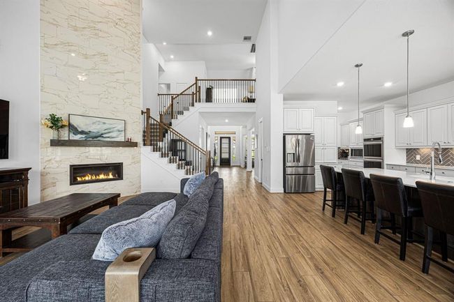 As you can see the living room is open to the kitchen, stairs and entryway. | Image 19