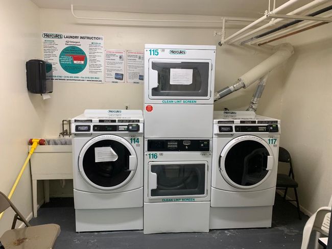 Community laundry room is conveniently located downstairs in the same building - no need to go outside | Image 14