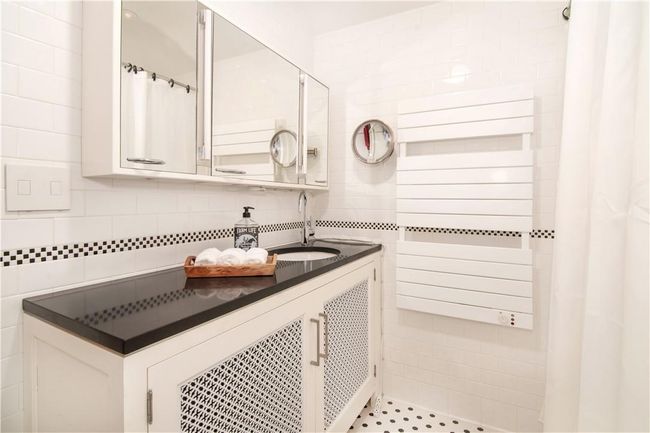 2nd floor hall bathroom with heated towel rack and radiant heated flooring. | Image 18