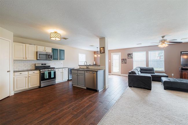 Kitchen is open to the family room. | Image 10
