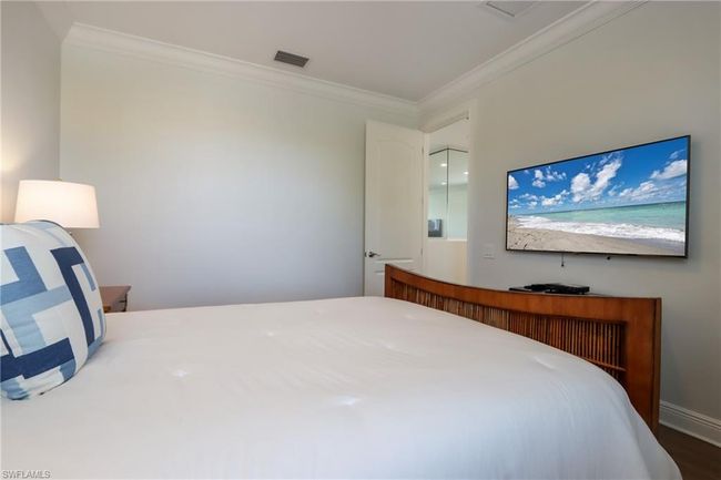 Bedroom featuring ornamental molding and wood finished floors | Image 21