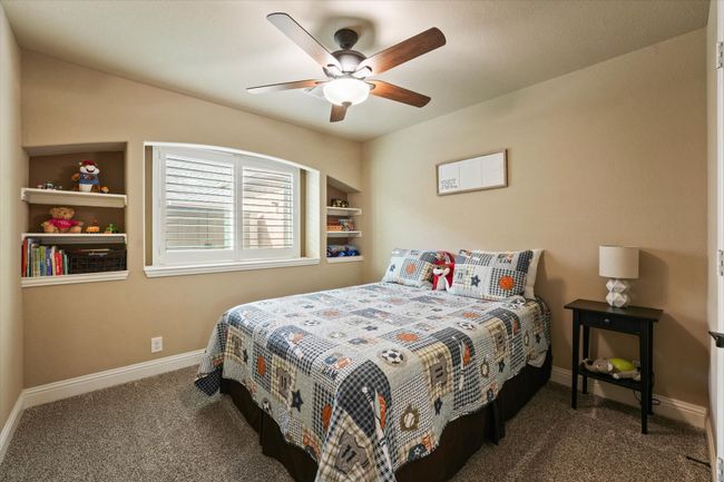 Carpeted bedroom with baseboards and a ceiling fan | Image 28