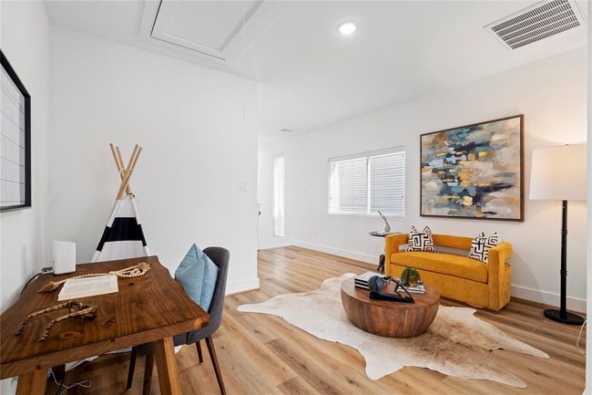 Strategically placed windows allow for abundant natural light, creating an open and airy feel throughout the home. | Image 16