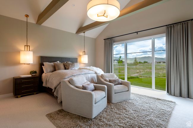 Bedroom featuring light colored carpet, high vaulted ceiling, a mountain view, beamed ceiling, and access to exterior | Image 26