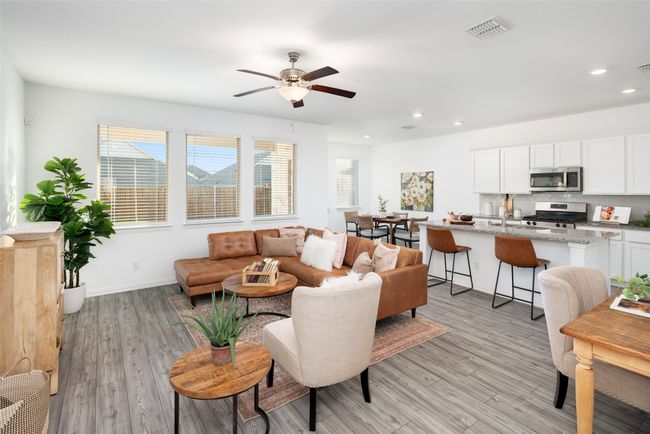 Living area with recessed lighting, light wood-style flooring, a ceiling fan, and baseboards | Image 4