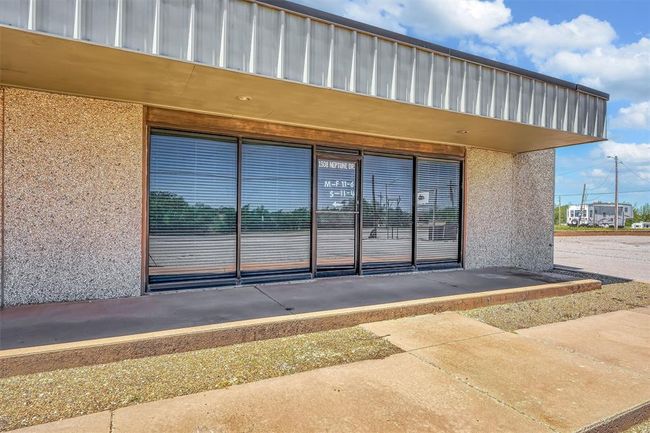 Doorway to property featuring stucco siding | Image 14