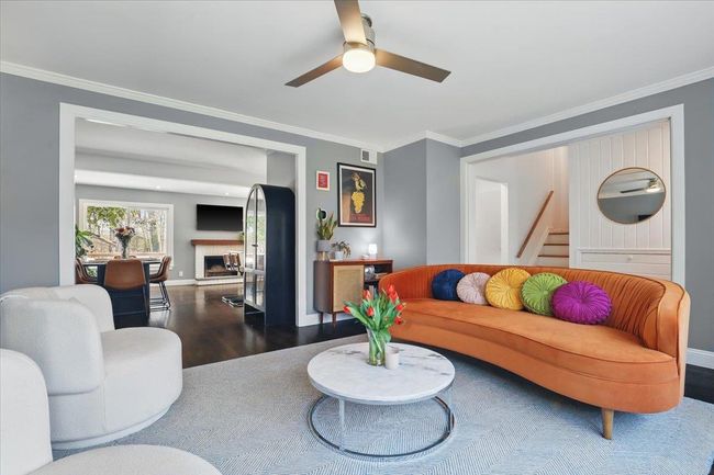 Another view of the living room with views of the dining room | Image 4