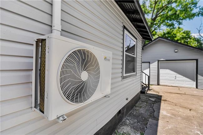 Exterior view of ac unit, driveway | Image 48
