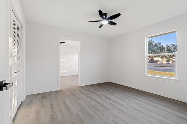 Unfurnished bedroom featuring ceiling fan, light hardwood / wood-style flooring, and a closet | Image 25
