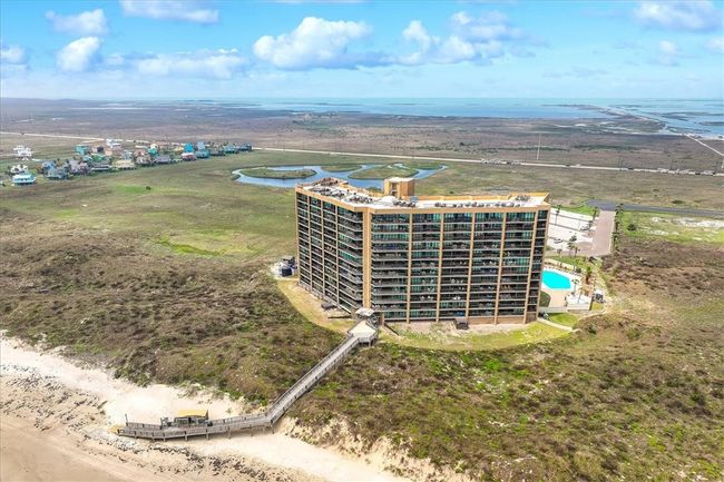 Aerial view of back of Sandpiper and beach walkover. | Image 40