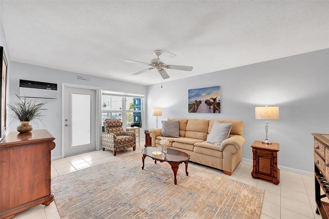 Being Sold Furnished, Turn-Key. Impact Windows & Doors also include Blinds and Retractable Screen Doors! Your Living Room, Dining Area are Bright, Spacious and Great for Quiet Times or Entertaining! | Image 29