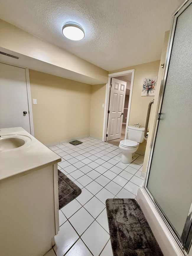 Lower leve 3/4 bathroom with tile floor and new neutral paint | Image 25