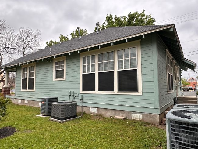 View of home's exterior with crawl space and a lawn | Image 24