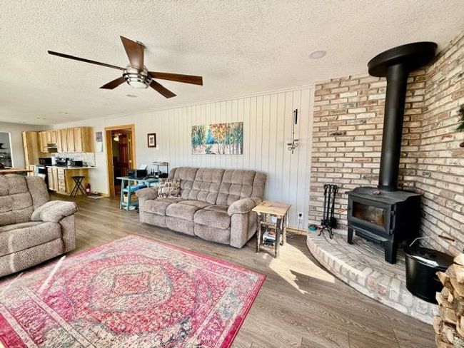 Nice living room with wood buring fireplace for chilly evenings | Image 7