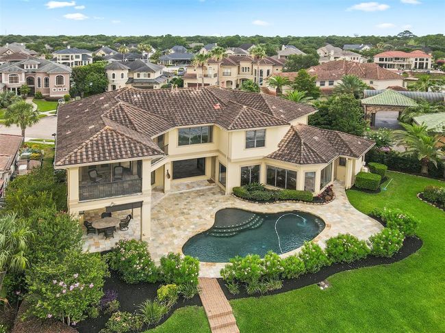 Surrounded by lush greenery and situated in an upscale neighborhood, it offers both luxury and privacy. | Image 50
