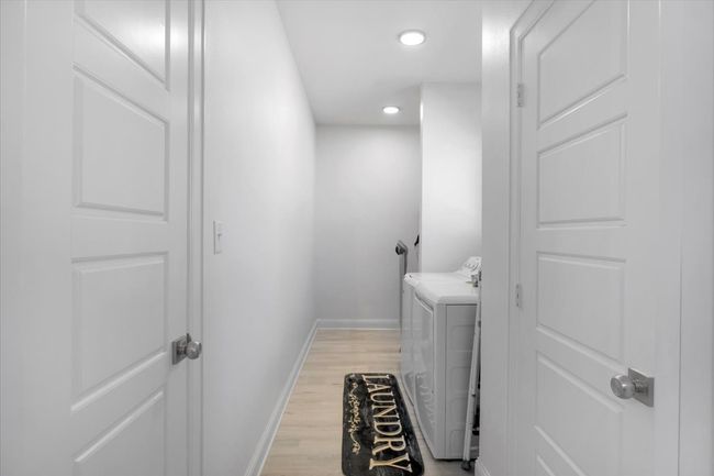 Washroom featuring recessed lighting, light wood finished floors, laundry area, baseboards, and washer and dryer | Image 29