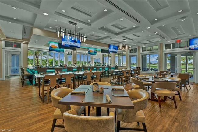 Dining room with hardwood / wood-style floors, coffered ceiling, french doors, and a healthy amount of sunlight | Image 18