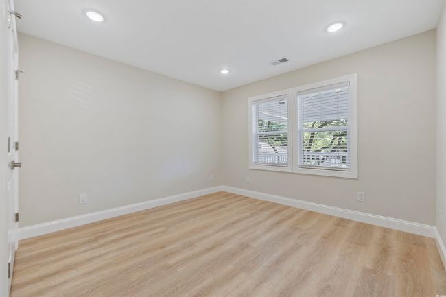 Spare room with light wood-style flooring, baseboards, and recessed lighting | Image 18