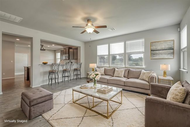 Living room featuring ceiling fan, wood finished floors, and recessed lighting | Image 4