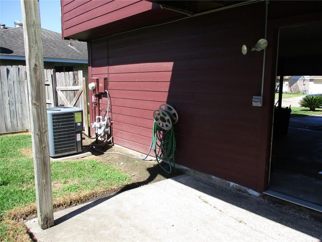 Extra spotlights in the back yard. Recently installed planks and supports for deck that shades the patio during mid-day. | Image 20